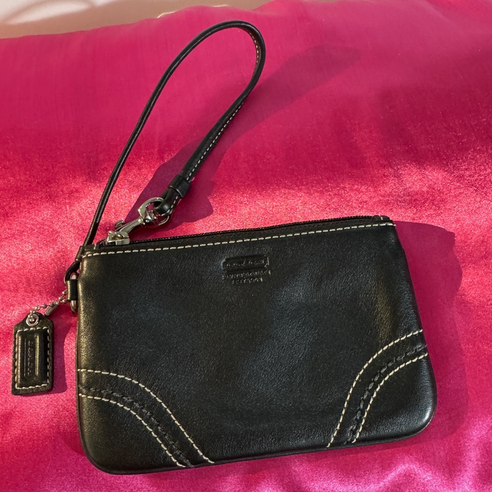 COACH Black Thin Wristlet w/ light purple inside lining Approx size 6”x4”